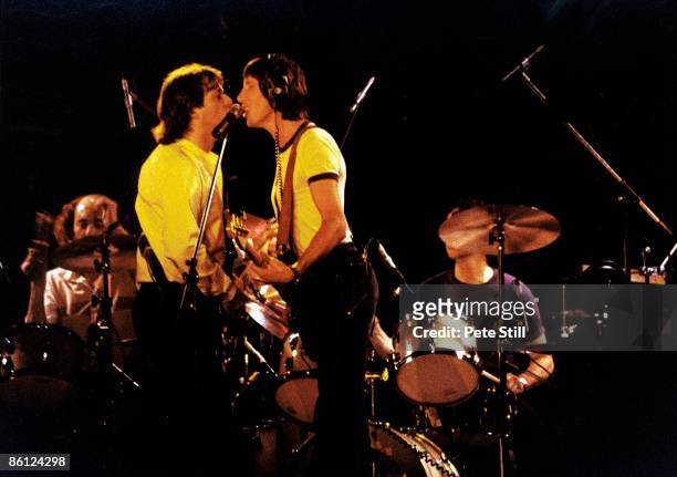Photo of PINK FLOYD and David GILMOUR and Roger WATERS, David Gilmour & Roger Waters at the mic performing live onstage during The Wall concert