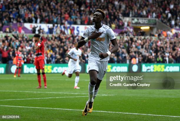 Tammy Abraham of Swansea City celebrates scoring his sides first goal during the Premier League match between Swansea City and Huddersfield Town at...