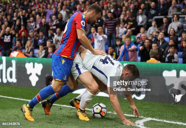 James McArthur of Crystal Palace and Gary Cahill of Chelsea battle for possession during the Premier League match between Crystal Palace and Chelsea...