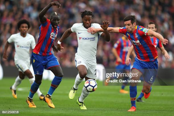 Michy Batshuayi of Chelsea battle for possession with Mamadou Sakho of Crystal Palace and Scott Dann of Crystal Palace during the Premier League...