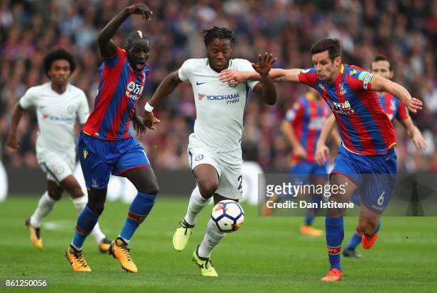 Michy Batshuayi of Chelsea battle for possession with Mamadou Sakho of Crystal Palace and Scott Dann of Crystal Palace during the Premier League...