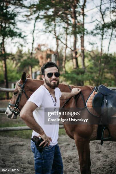 cowboy  on ranch training - handsome cowboy stock pictures, royalty-free photos & images