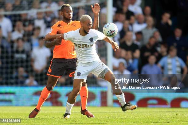 Reading's Leandro Bacuna and Leeds United's Kemar Roofe battle for the ball during the Sky Bet Championship match at Elland Road, Leeds.