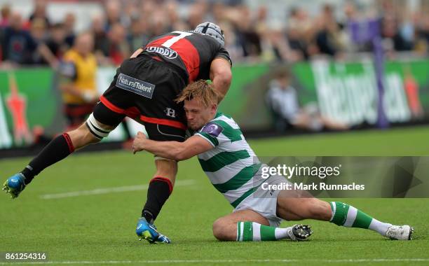 Sam Stuart of Newcastle Falcons tackles Ollie Griffiths of Dragons during the European Rugby Challenge Cup match between Newcastle Falcons and...