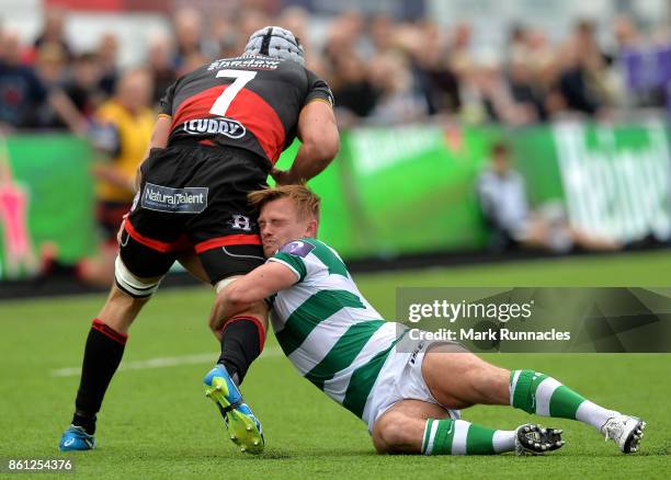 Sam Stuart of Newcastle Falcons tackles Ollie Griffiths of Dragons during the European Rugby Challenge Cup match between Newcastle Falcons and...