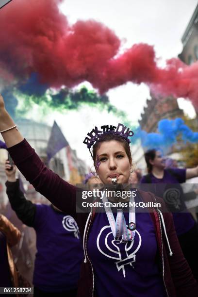 Ellie Evans, who has been questioned by police for holding a placard with the slogan 'Fuck the DUP' at a Gay Pride march wears a head dress with the...