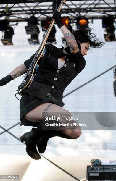 Photo of MINDLESS SELF INDULGENCE and Lyn Z, Lyn-Z performing on stage, jumping