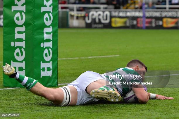 Mark Wilson of Newcastle Falcons scores a try in the second half during the European Rugby Challenge Cup match between Newcastle Falcons and Dragons...