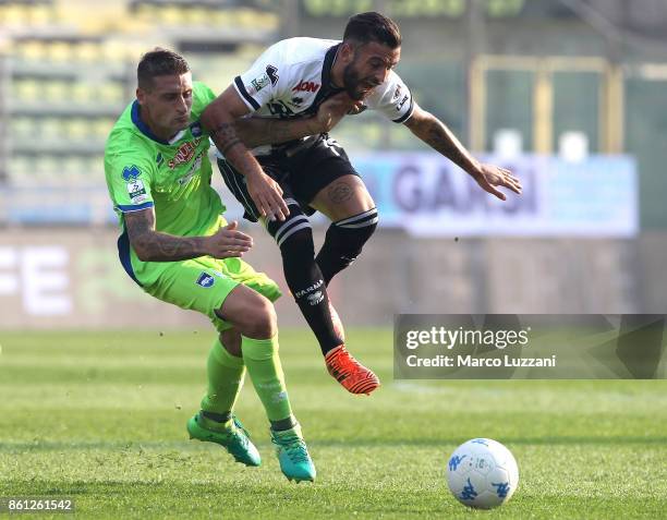 Roberto Insigne of Parma Calcio competes for the ball with Andrea Coda of Pescara during the Serie B match between Parma Calcio v Pescara on October...