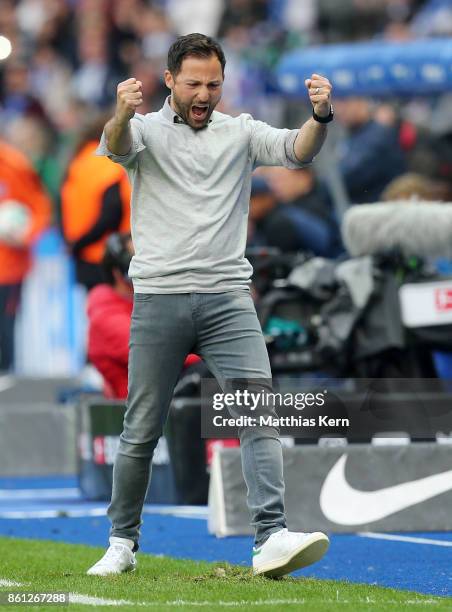 Head coach Domenico Tedesco of Schalke jubilates after winning the Bundesliga match between Hertha BSC and FC Schalke 04 at Olympiastadion on October...