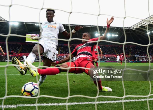 Swansea striker Tammy Abraham scores his second goal despite the challenge of Zanka during the Premier League match between Swansea City and...