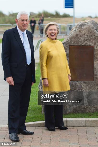 Hillary Clinton and Swansea University Vice Chancellor Prof. Richard Davies pose as Hillary unveils a stone with a plaque for the renaming of the law...