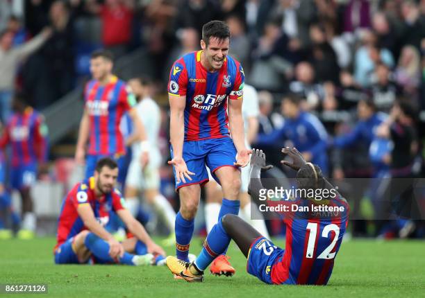 Mamadou Sakho of Crystal Palace and Scott Dann of Crystal Palace celebrate victory after the Premier League match between Crystal Palace and Chelsea...