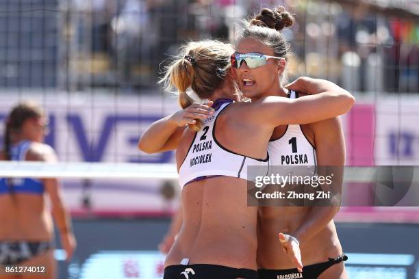 Kinga Kolosinska and Katarzyna Kociolek of Poland celebrate during the semi final match against Brooke Sweat and Summer Ross of the United States on...