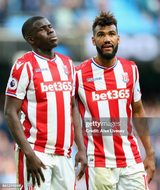 Kurt Zouma of Stoke City and Maxim Choupo-Moting of Stoke City react during the Premier League match between Manchester City and Stoke City at Etihad...