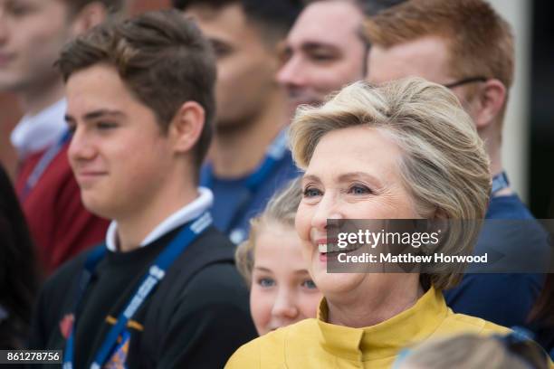 Hillary Clinton poses for a picture with schoolchildren from Swansea and Narberth at Swansea University where she was given a Honorary Doctorate of...