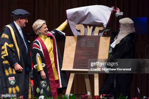 Hillary Clinton unveils a plaqueto commemorate the renaming of the law school building to the Hillary Roddham Clinton School of Law at Swansea...