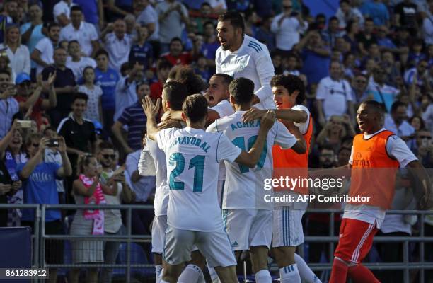 Real Madrid players celebrate their second goal during the Spanish league football match Getafe CF vs Real Madrid CF at the Col. Alfonso Perez...