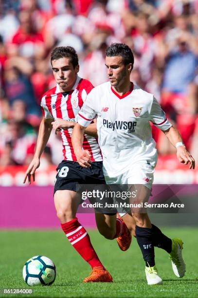 Sebastien Corchia of Sevilla FC competes for the ball with Inigo Cordoba of Athletic Club during the La Liga match between Athletic Club Bilbao and...