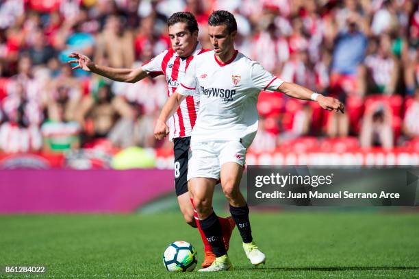 Sebastien Corchia of Sevilla FC competes for the ball with Inigo Cordoba of Athletic Club during the La Liga match between Athletic Club Bilbao and...