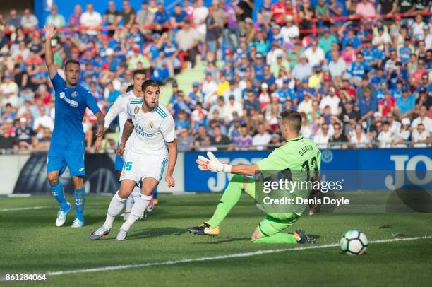 Theo Hernandez of Real Madrid CF shoots past Vicente Guaita of Getafe during the La Liga match between Getafe and Real Madrid at Coliseum Alfonso...