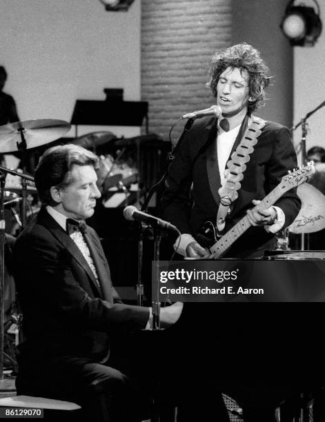 Photo of Jerry Lee LEWIS; L-R: Jerry Lee Lewis, Keith Richards performing together on 'Saturday Night Live'