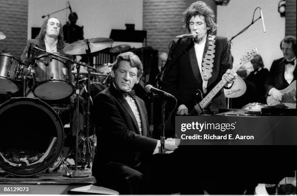 Photo of Jerry Lee LEWIS; L-R: Mick Fleetwood, Jerry Lee Lewis, Keith Richards performing together on 'Saturday Night Live'