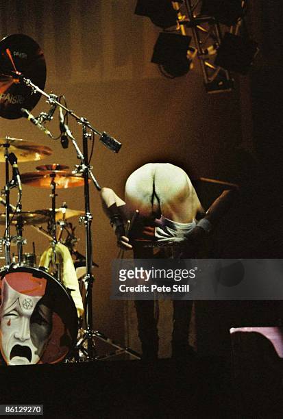 Photo of MOTLEY CRUE, Tommy Lee performing live onstage, showing bottom, mooning