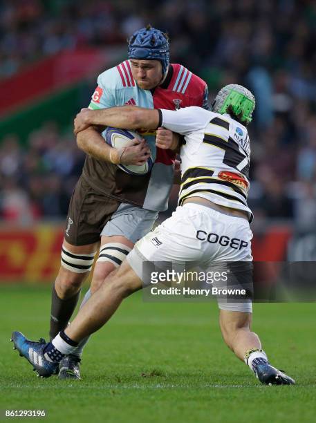 James Horwill of Harlequins tackled by Zeno Kieft of La Rochelle during the European Rugby Champions Cup match between Harlequins and La Rochelle at...