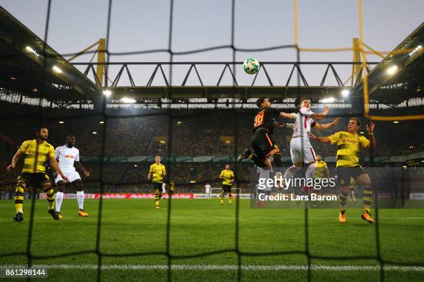 Marcel Sabitzer of Leipzig scores a goal past goalkeeper Roman Buerki of Dortmund to make it 1:1 during the Bundesliga match between Borussia...