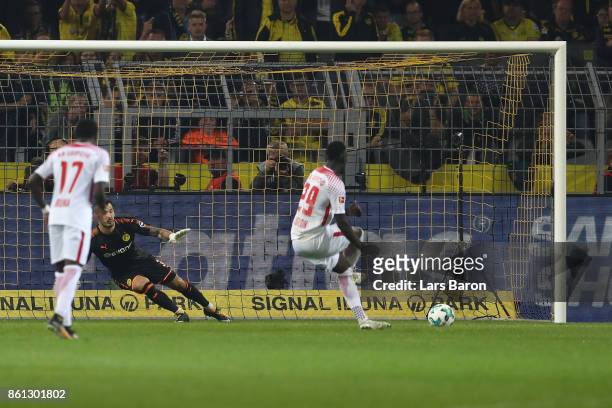 Jean-Kevin Augustin of Leipzig scores to make it 1:3 after Leipzig was awarded a penalty and Sokratis Papastathopoulos of Dortmund sent of with a red...