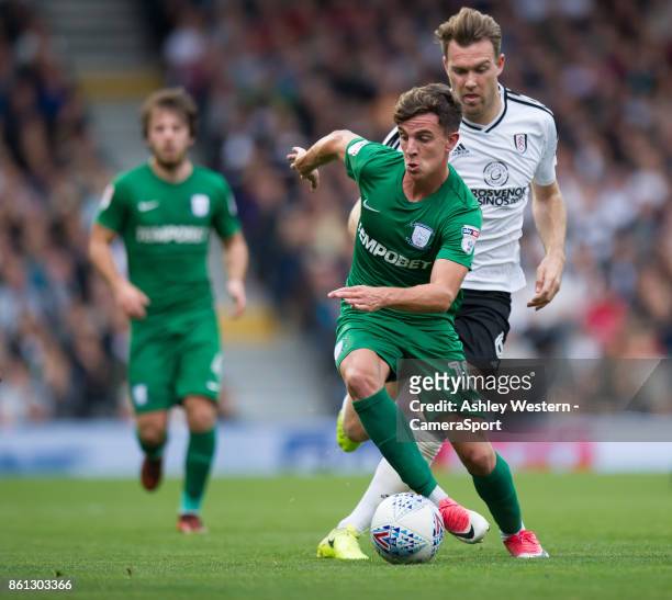Preston North End's Josh Harrop holds off the challenge from Fulham's Kevin McDonald during the Sky Bet Championship match between Fulham and Preston...