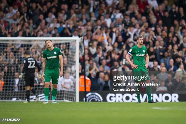 Preston North End's Jordan Hugill and Paul Huntington dejected as Fulham's Denis Odoi scores his side's equalising goal to make the score 2-2 during...