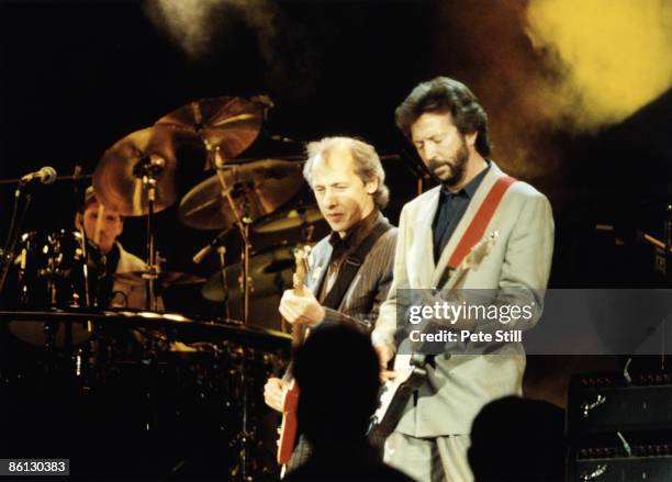 Photo of Mark KNOPFLER and DIRE STRAITS and Eric CLAPTON, Mark Knopfler and Eric Clapton performing on stage at the Nelson Mandela 70th Birthday...