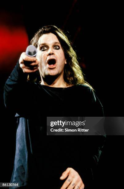 Photo of BLACK SABBATH and Ozzy OSBOURNE, Ozzy Osbourne performing on stage, pointing microphone