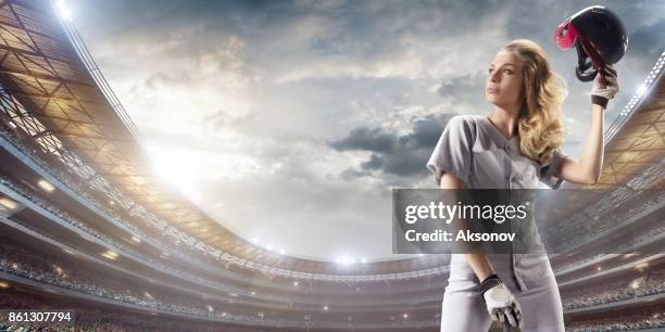 softball female player on a professional arena - softball glove stock pictures, royalty-free photos & images