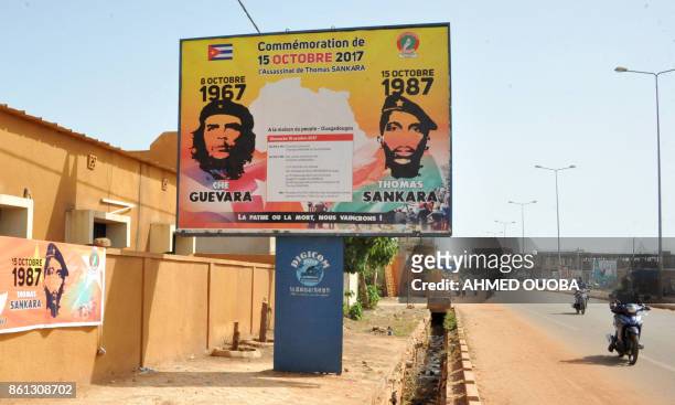 Picture taken on October 14, 2017 in a street of Ouagadougou shows a poster celebrating former President Thomas Sankara, known as "Africa's Che...