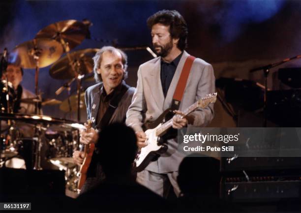 Photo of DIRE STRAITS and Mark KNOPFLER and Eric CLAPTON, Mark Knopfler and Eric Clapton performing on stage at the Nelson Mandela 70th Birthday...