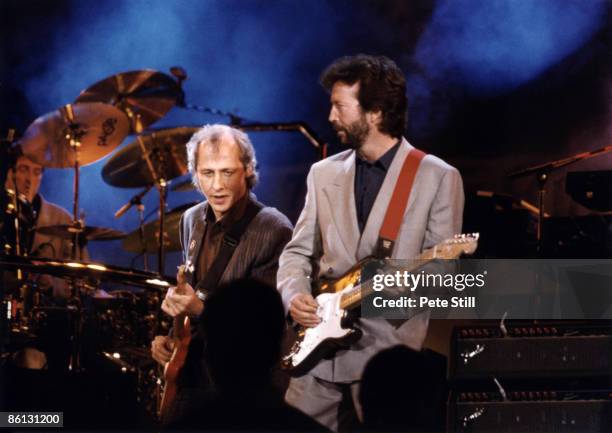 Photo of DIRE STRAITS and Mark KNOPFLER and Eric CLAPTON, Mark Knopfler and Eric Clapton performing on stage at the Nelson Mandela 70th Birthday...