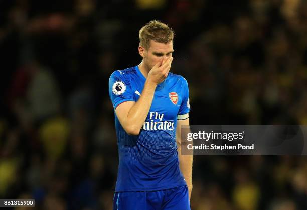 Per Mertesacker of Arsenal looks dejected in defence the Premier League match between Watford and Arsenal at Vicarage Road on October 14, 2017 in...