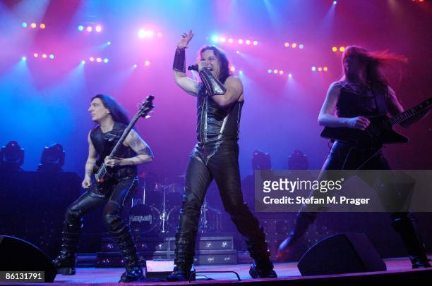 Photo of MANOWAR and Joey DeMAIO and Eric ADAMS and Karl LOGAN, L-R Joey DeMaio, Eric Adams and Karl Logan performing on stage