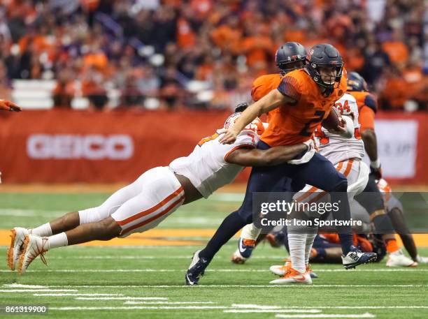 Syracuse Orange quarterback Eric Dungey is wrapped up by Clemson Tigers defensive end Austin Bryant during a college football game between Clemson...