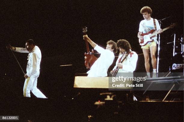 Photo of Brian MAY and QUEEN and Freddie MERCURY and John DEACON, L-R: Freddie Mercury, Spike Edney, Brian May and John Deacon performing live on...