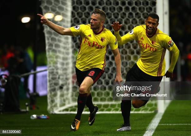 Tom Cleverley of Watford celebrates as he scores their second goal with Etienne Capoue of Watford during the Premier League match between Watford and...