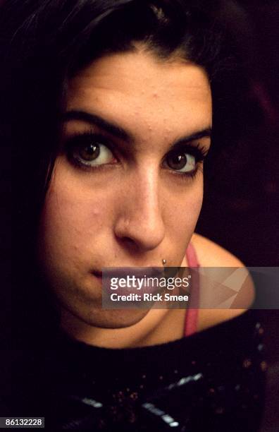 1st FEBRUARY: English singer Amy Winehouse posed in a launderette on Camden Parkway, North London in February 2003.