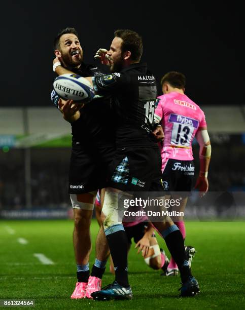Tommy Seymour of Glasgow Warriors celebrates scoring his side's first try with Ruaridh Jackson of Glasgow Warriors during the European Rugby...