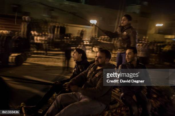 Cairo, Egypt Every Thursday evening men and horses gather on the banks of the canal in Shubra and run their hourses on March 06, 2014 in Cairo,...