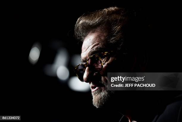 French actor and singer Eddy Mitchell attends the opening ceremony of the 9th edition of Lumiere film festival, on October 14, 2017 in Lyon central...