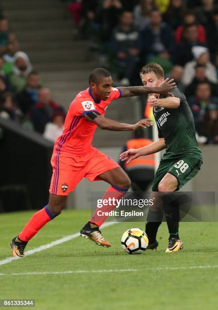 Sergei Petrov of FC Krasnodar is challenged by Vitinho of FC CSKA Moscow during the Russian Premier League match between FC Krasnodar v FC CSKA...