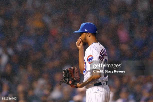 Carl Edwards Jr. #6 of the Chicago Cubs prepares to throw a pitch during game four of the National League Division Series against the Washington...